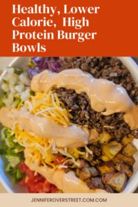 Lower calorie burger bowl with lean ground beef, crispy potatoes, lettuce, tomato, pickles, cheese, and creamy burger sauce.