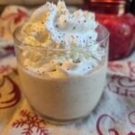 Close-up of sugar-free eggnog topped with whipped cream and nutmeg